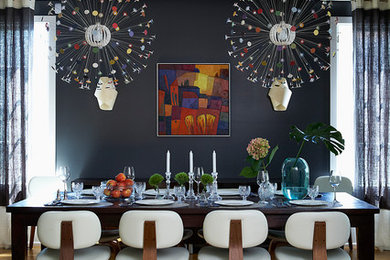 Example of a trendy dining room design in Toronto with black walls