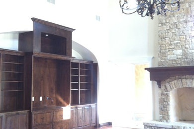 Tuscan family room photo in Austin