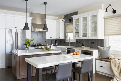 Example of a transitional dark wood floor and brown floor kitchen/dining room combo design in Chicago with beige walls
