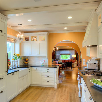 Arch doorway visually broadens kitchen entrance