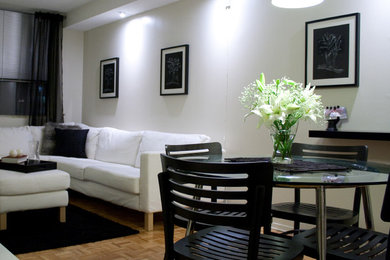 Example of a small minimalist loft-style living room design in Toronto with white walls
