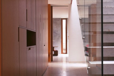 Example of a large minimalist concrete floating open staircase design in London