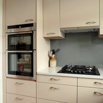 Contemporary high gloss cashmere kitchen with built in appliances