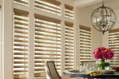 Inspiration for a mid-sized timeless enclosed dining room remodel in Orange County with beige walls and no fireplace