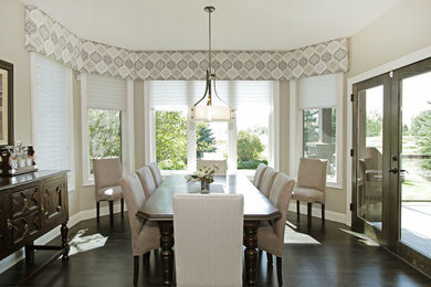 Example of a mid-sized classic dark wood floor and black floor kitchen/dining room combo design in Calgary with gray walls