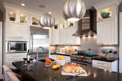 Inspiration for a transitional dark wood floor kitchen remodel in Atlanta with recessed-panel cabinets, white cabinets, stainless steel appliances and an island