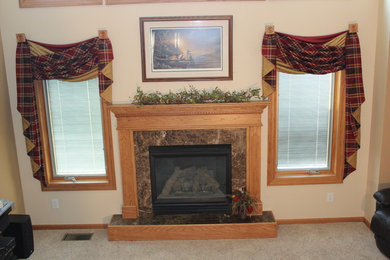 Example of a small minimalist enclosed carpeted and beige floor living room design in Other with beige walls, a standard fireplace, a tile fireplace and no tv