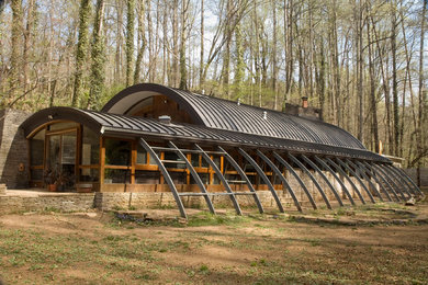 Example of an eclectic glass exterior home design in New York