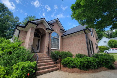 Large elegant two-story gable roof photo in Raleigh with a shingle roof and a black roof