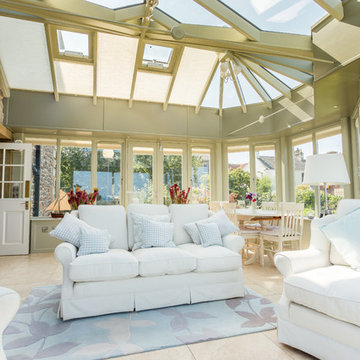 Stilted orangery with glazed balcony and seaside view