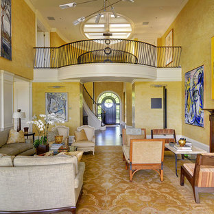 Design ideas for a mediterranean formal open plan living room in New York with yellow walls, a standard fireplace and no tv.