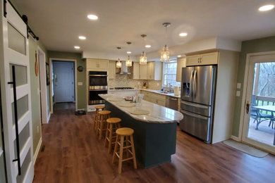 Eat-in kitchen - mid-sized modern galley laminate floor eat-in kitchen idea in Other with granite countertops, mosaic tile backsplash and an island