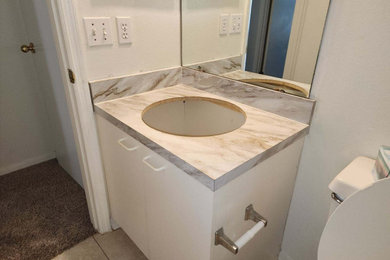 Small kids bathroom in Other with laminate benchtops, white benchtops and a single vanity.