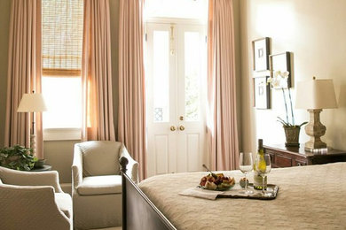 Bedroom - mid-sized traditional guest medium tone wood floor and brown floor bedroom idea in New Orleans with beige walls and no fireplace