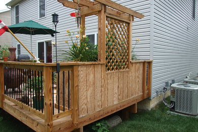 Inspiration for a mid-sized modern backyard deck remodel in Baltimore with a fire pit and no cover