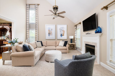 Example of a transitional carpeted and beige floor living room design in New York with beige walls, a standard fireplace and a stone fireplace