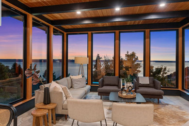 Example of a mid-century modern home design design in Seattle