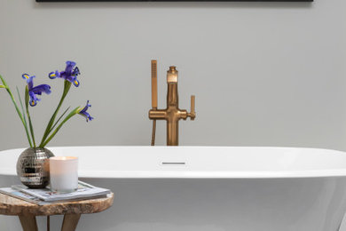 Mid-sized minimalist master white tile white floor and double-sink freestanding bathtub photo in Chicago with shaker cabinets, gray cabinets, white walls, marble countertops, gray countertops and a freestanding vanity