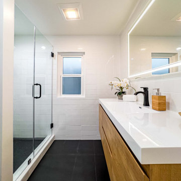 Primary Bath with Full-Width Oak Vanity and Backlit Mirror
