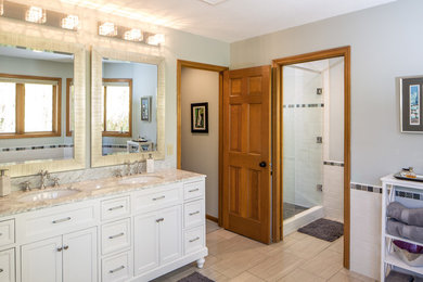 Mid-sized modern master bathroom in Minneapolis with furniture-like cabinets, white cabinets, a freestanding tub, a double shower, gray tile, ceramic tile, green walls, ceramic floors, an integrated sink, a one-piece toilet and marble benchtops.