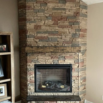 Living Room With Fireplace Design using Desert Sunrise Stacked Stone