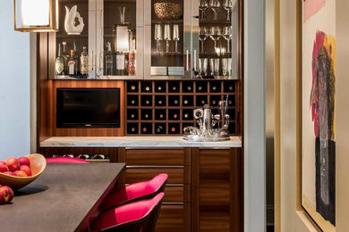 Inspiration for a mid-sized contemporary l-shaped medium tone wood floor and brown floor enclosed kitchen remodel in Chicago with an undermount sink, flat-panel cabinets, brown cabinets, quartz countertops, gray backsplash, stone slab backsplash, paneled appliances and an island