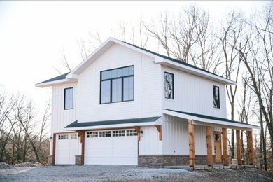 Example of a cottage exterior home design in Other