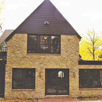 Tudor Revival Central Passage Home - Brown Gable Roof & Sand Color Stone Facing