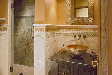 Inspiration for a mediterranean alcove shower remodel in Denver