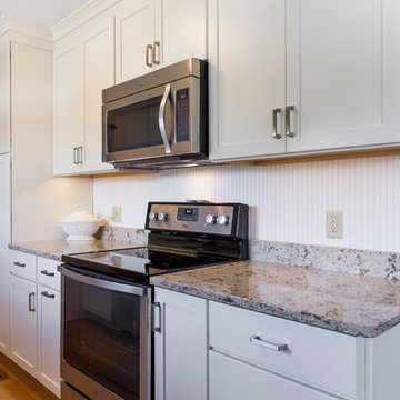 White Painted Shaker Galley Kitchen with Quartz countertops