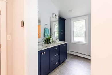 Bathroom - mid-sized transitional master white tile double-sink bathroom idea in Boston with shaker cabinets, blue cabinets, granite countertops, white countertops and a built-in vanity