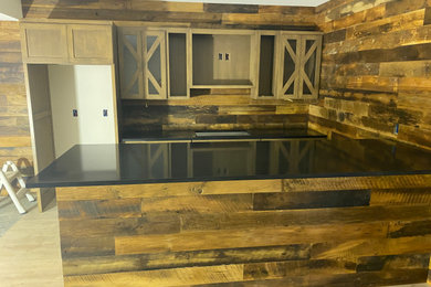 Kitchen photo in Chicago with quartz countertops and black countertops
