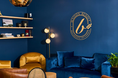 Inspiration for a large open concept concrete floor living room remodel in San Francisco with blue walls and no fireplace