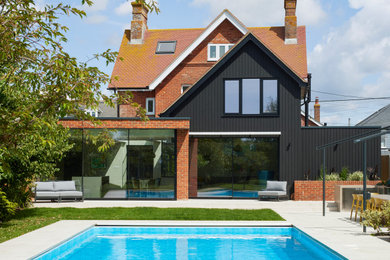 Photo of a large contemporary home in Hampshire.