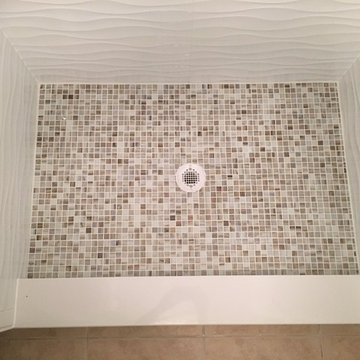 Fiberglass shower replacement with tile shower.