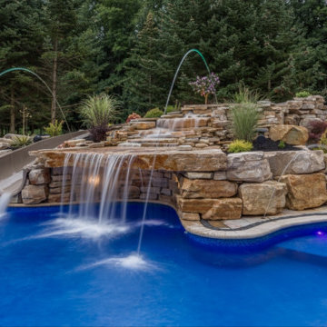 Custom Pool Project with Grotto and Large Waterslide
