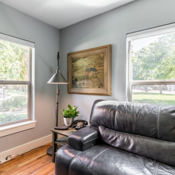 Living Room with Pirouette Window Shadings with PowerView® Raised and Hidden