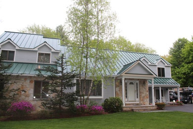 Large traditional beige two-story mixed siding gable roof idea in Boston