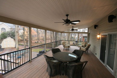 Large elegant screened-in back porch photo in Baltimore with a roof extension