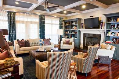 Eclectic family room in Nashville with dark hardwood floors and a standard fireplace.