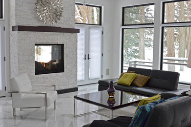 Inspiration for a mid-sized contemporary formal and open concept marble floor living room remodel in Dallas with white walls, a two-sided fireplace, a stone fireplace and no tv