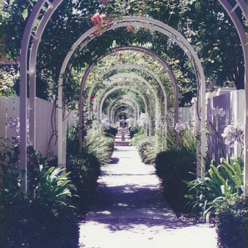 Rose Arbor with fountain at end.