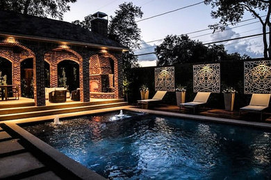 Design ideas for a large traditional swimming pool in Dallas.