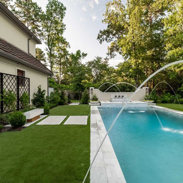 Rectangular pool, covered patio and kitchen, outdoor shower, landscaping
