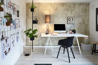 Mid-sized scandinavian home office in Esbjerg with white walls, medium hardwood floors, no fireplace and a freestanding desk.