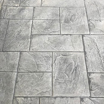 Pool Extension Stamped Concrete with a matching Block Fire pit and Wall