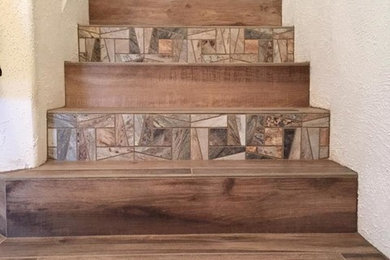 Example of a mid-sized mountain style tile straight staircase design in Albuquerque with tile risers