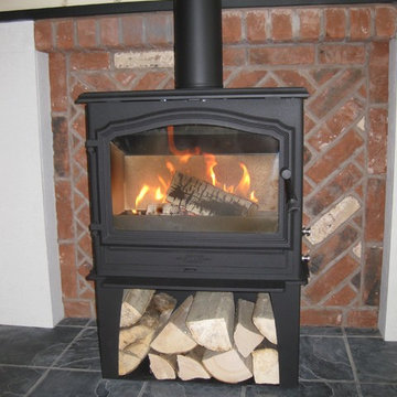 Esse 100 with log store, twin wall flue and alter fire place.By Embers & Ash
