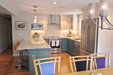 This is an example of a mid-sized transitional u-shaped eat-in kitchen in Other with an undermount sink, shaker cabinets, turquoise cabinets, quartzite benchtops, white splashback, ceramic splashback, stainless steel appliances, light hardwood floors, with island, beige floor and white benchtop.