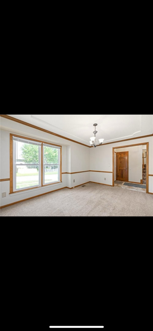 How much oak trim should I paint white in our 80s built home?